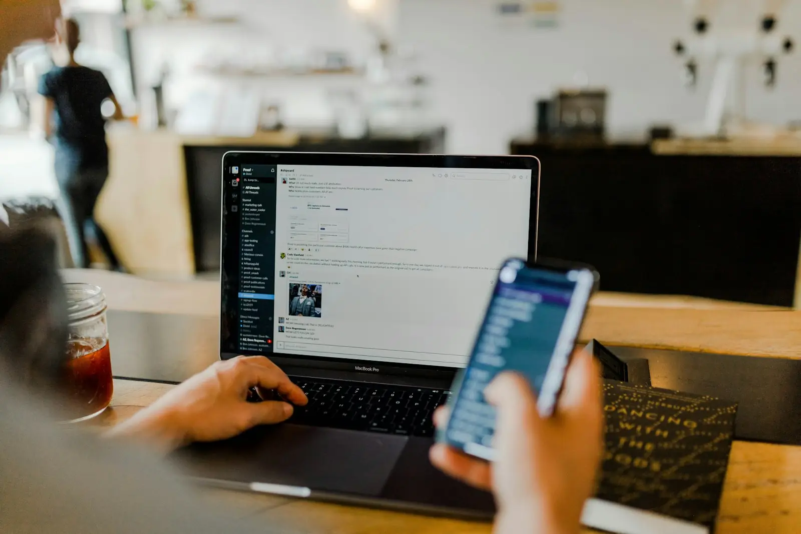 Person using a product on phone and laptop